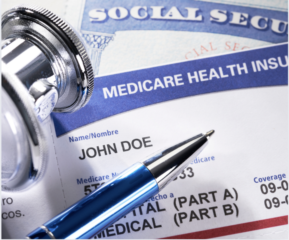 a medicare health insurance card and a stethoscope sit on top of a social security card